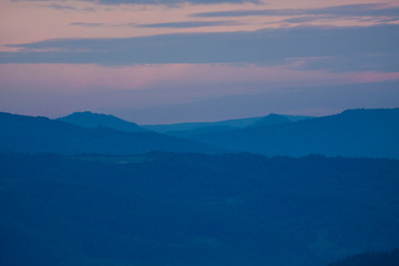 Beautiful scenery with forest, mountains and clear sky