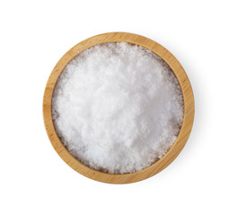 Salt in wood bowl isolated on white background. top view