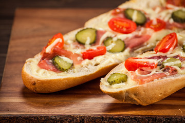 Long roast sandwich on cutting board