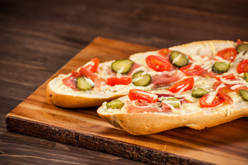 Long roast sandwich on cutting board