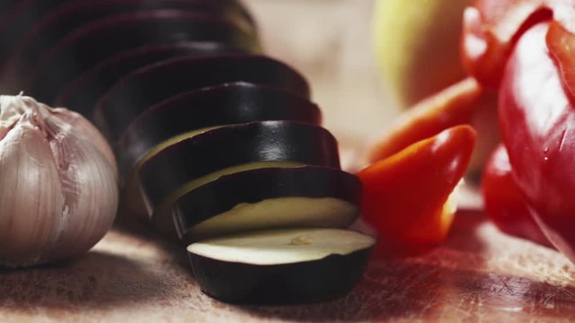 Slide shot of fresh vegetables, eggplant, bell pepper, lemon, garlic and rosemary