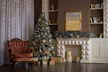 beautifully decorated Christmas tree with gifts, New Year decorations, beautiful armchair, New Year decorations in the studio