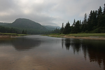 Fototapeta na wymiar Pond with reflected mountains and trees in Acadia National Park, Maine.