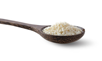 rice in wood spoon isolated on white background.