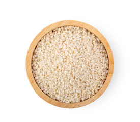 Sesame in wood bowl isolated on white background. top view