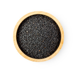 sesame in wood bowl isolated on white background. top view