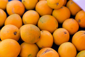 soft focus tropic fresh orange fruits background concept open air market counter