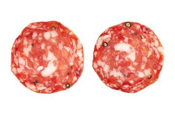 Salami slices  on white background .