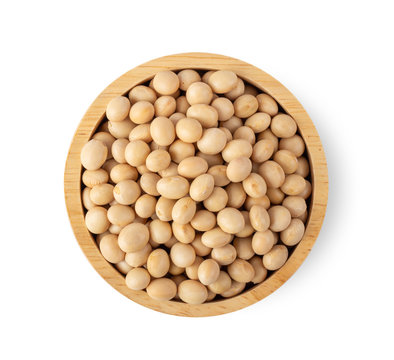 soy beans in wood bowl isolated on white background. top view