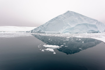 Fototapeta na wymiar Massive iceberg on arctic ocean in greenland