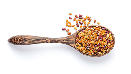 beans in wood spoon isolated on white . top view