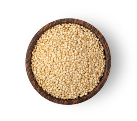 quinoa seeds in wood bowl isolated on white background. top view
