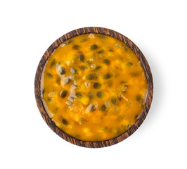 passion fruit in wood bowl isolated on white background. top view