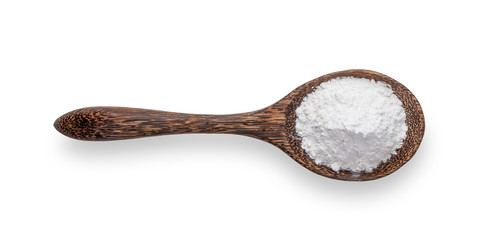 Pile of flour in wood spoon isolated on white background .top view
