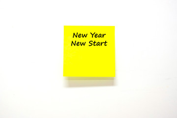 New Year New Start text with stick note paper or post it on white background. reminder and business concept