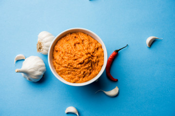 Garlic chutney, made using lahsun/lehsun originating from the India, served in a bowl over moody background. selective focus