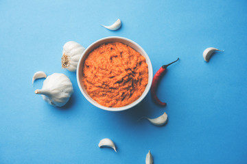 Garlic chutney, made using lahsun/lehsun originating from the India, served in a bowl over moody background. selective focus
