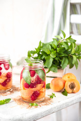 Cold Fruit Infused Detox Water with apricots raspberries and mint