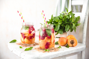 Cold Fruit Infused Detox Water with apricots raspberries and mint