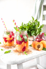 Cold Fruit Infused Detox Water with apricots raspberries and mint