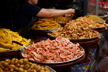 pickled fruits shop in a market in Thailand