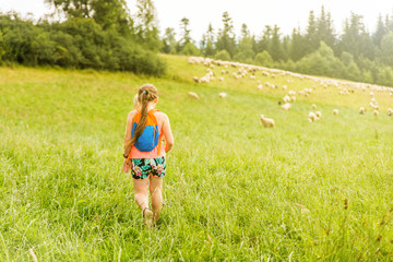 Girl walking around the park and meadow