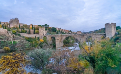 Fototapeta premium The Puente de San Martn (St Martin's Bridge), a medieval bridge across the river Tagus in Toledo, Spain. Constructed in the late 14th century. 