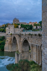 Obraz premium The Puente de San Martn (St Martin's Bridge), a medieval bridge across the river Tagus in Toledo, Spain. Constructed in the late 14th century. 