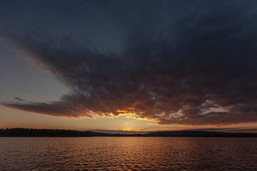 Fototapeta na wymiar North Russian lake landscape on sunset, Murmansk region