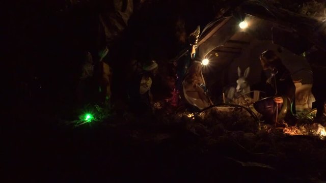 Holy Family in Christmas Nativity scene in the dark