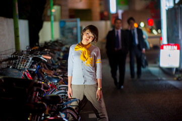 Asian female model poses for pictures on the street