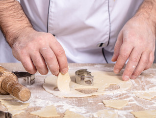 male cook preparing Christmas cookies