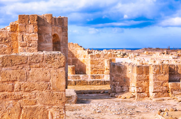 Ancient stone ruins with blue sky.