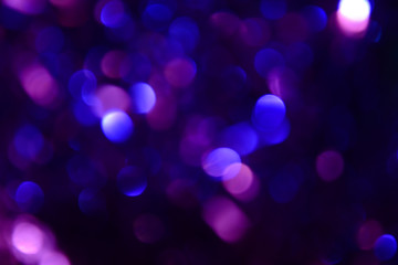 Bokeh. Holiday background. Christmas lights. Glitter. Defocused sparkles. New Year backdrop....