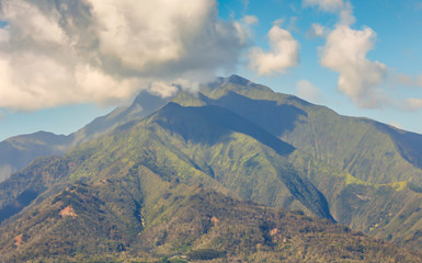 view of Hawaiian mountains with low cloud 