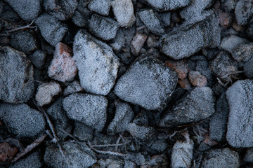 Ice and rocks on the beach. Frozen background