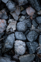 Ice and rocks on the beach. Frozen background