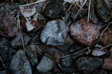 Ice and rocks on the beach. Frozen background