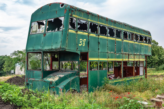 Novi Sad, Serbia May 26, 2018: Rusty Abandoned green Double-Decker Bus
