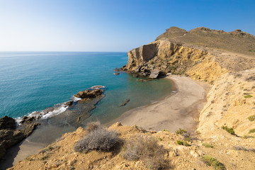 Yellow or Amarillos Beach, famous wild and beautiful seaside, from top of the cliff, in Gata Cape Natural Park, Almeria (Nijar, Andalusia, Spain, Europe) 
