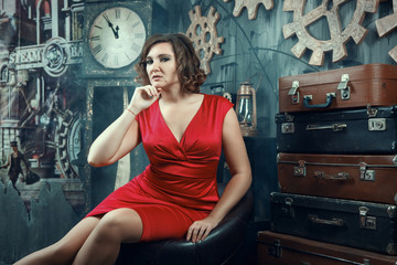 Beautiful model is posing in a dark studio