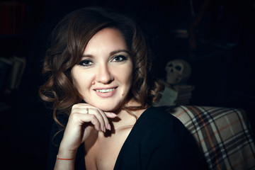 Beautiful model is posing in a dark studio