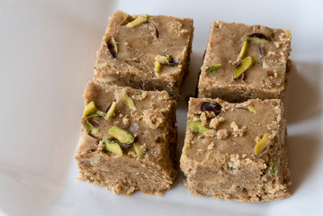 Adadiya (sweetened black gram flour fudges made with cardamom, ginger, nutmeg,almonds and saffron ) – Indian Sweet made in the winters