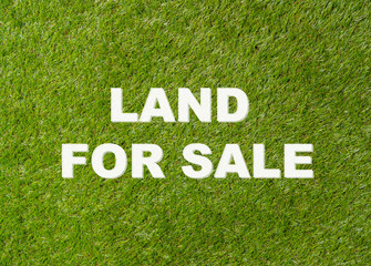 Land For Sale text written on green grass conceptual image of property investment and real estate