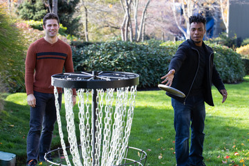 Men playing disc golf 