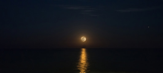 full moon over the sea