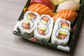 Sushi and Sashimi rolls. Fresh made Sushi set with salmon, prawns, wasabi and ginger. Traditional Japanese cuisine