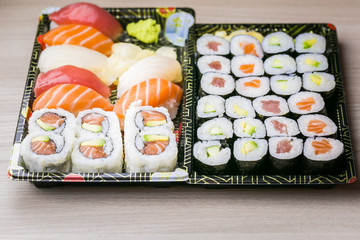 Sushi and Sashimi rolls. Fresh made Sushi set with salmon, prawns, wasabi and ginger. Traditional Japanese cuisine