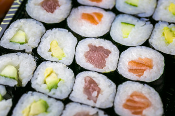 Sushi and Sashimi rolls. Fresh made Sushi set with salmon, prawns, wasabi and ginger. Traditional Japanese cuisine