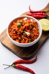 Hot and spicy Hot chilli chutney using lal mirch, cumin seeds, lemon juice and coriander. served in a bowl. selective focus